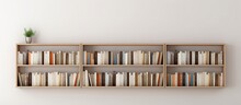 Photo Of A Bookshelf Filled With Books Against A Clean White Wall With Copy Space