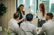 © SpaceOak - In diverse workspace, project manager presents eco-friendly solar panels, and sustainable solutions