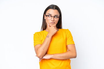 Wall Mural - Young caucasian woman isolated on white background thinking an idea while looking up