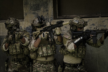 United States Army ranger during the military operation. Professional marine soldiers training with weapon on a military range.