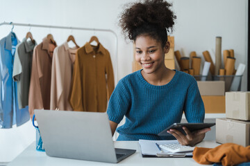 Woman start up small business owner at workplace. small business entrepreneur SME or freelance asian woman working with box at home.