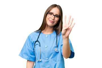 Young nurse caucasian woman over isolated background happy and counting four with fingers