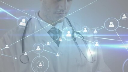 Sticker - Animation of profile icons connected with lines over male caucasian doctor using digital tablet