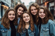 © acrogame - Teenager girls with long hair and jeans together for fun in town, looking at the camera and smiling