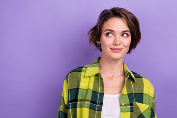 Poster - Photo of cute young woman wear checkered stylish casual shirt look dreaming empty space new offer sale isolated on purple color background