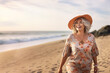 © Kalim - AI generated image of plus size mature woman on the beach