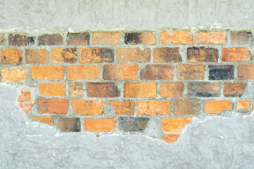 Wall Mural - Old dirty grey concrete background texture with orange bricks in the middle used in decorative art work. Gray concrete wall texture or brick wall with strange pattern and stripes