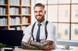 businessman with tattoos in a an office