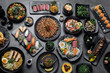 many traditional japanese food dishes variety on grey background in Tokyo restaurant