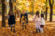 © soleg - portrait of a large family with children in an autumn city park, happy people playing together and throwing yellow leaves, beautiful nature, bright sunny day