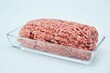 Raw meat ground into minced meat on a white background. Pork, beef or lamb. Different parts of meat products for different dishes.