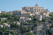 View on castle of old medieval town Gordes on the rock, Luberon, Vaucluse, landscape of Provence France, Europe in july. Beautiful ancient buildings with roof tiles. 12th century houses. 