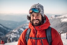 Handsome Young Man With Beard And Moustache In Red Jacket And Hat On The Background Of Mountains