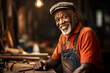 An old african american male craftsman are working happily with wooden planks in a old workshop wearing an apron
