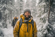 A young bearded man enjoys a snowy forest in Lapland