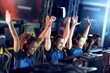 © Friends Stock - Team of happy professional cyber sport gamers celebrating success while participating in eSports tournament, playing online video games