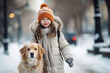  girl in winter clothes walks her dog along snowy street