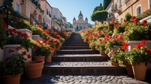 A Vibrant View Of The Spanish Steps In Rome, With Flowers In Full Bloom And The TrinitÃ  Dei Monti Church In The Backdrop.
