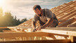 © redflower - Carpenter builds a roof on the house