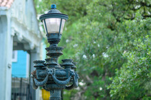 Selective Focus On Elaborately Designed Historic Street Lamp On A Public Street In Uptown New Orleans, Louisiana, USA