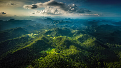 Aerial top view forest tree, Rainforest ecosystem and healthy environment concept background, Texture of green tree forest view from above, Beautiful sunrise over the mountains of western Thailand.