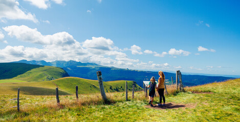 Wall Mural - Mother and son enjoying panoramic view of Auvergne,  volcanic chain- France