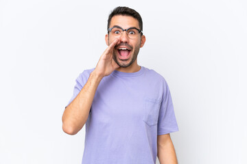 Young caucasian man isolated on white background with surprise and shocked facial expression