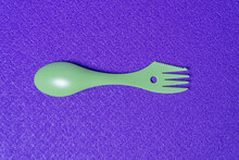 Plastic Travel Spoon And Fork On Purple Background
