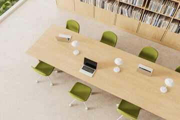 Top view of library interior with bookshelves and desk with chairs, window