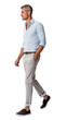 Isolated handsome young bearded man wearing a blue shirt and beige chinos trousers, walking, cutout on transparent background, ready for architectural visualisation.