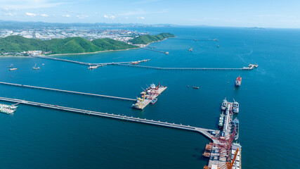 Cargo container Ship running on Bridge Cargo Shipyard. Container ship under the crane Sea Port service logistics and transportation. International Shipping Depot Customs Port for import export trading