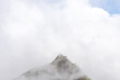 © Phongsak - Top of peak mountain forest with white clouds or fog and blue sky of 'LerGuaDa' or 'Ler Gwa Dor' Tak province, Thailand, Asia.