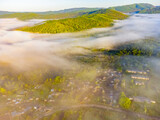 Fototapeta Góry - Photos of the hills and the village were taken from a drone in the early morning.  Kuldur is an urban—type settlement in the Irradiation district of the Jewish Autonomous Region of Russia. Resort. 
