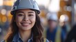 © Neural Pixels - Beatiful confidence asian woman builder worker in uniform and safety helmet smilling. Labour day.
