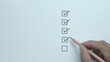 © Thanadon88 - Businessman making correct mark in check box for document quality control checklist and business approval project concept