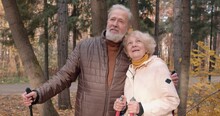 Smiling Cheerful Old Couple Enjoying Beautiful Landscape In The Forest Slow Motion, Mature Hikers Looking Around, Watching Flying Birds, Adventure, Happiness