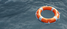 Lifebuoy On Blue Ocean Background. Orange Color Life Buoy Ring, Marine Safety