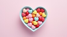  A Heart Shaped Bowl Filled With Candy Hearts On A Pink Background.  Generative Ai
