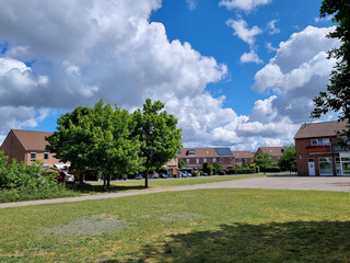 Wall Mural - house on the hill at a sunny day with beautiful cloudy sky