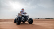 © Kzenon - Woman riding sand dunes ATV in the Dubai desert
