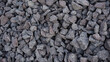 Crushed stone mounds.Grey crushed stones in close up,Versatile building material for horticulture,landscape gardening or road construction,Material for railroad construction.
