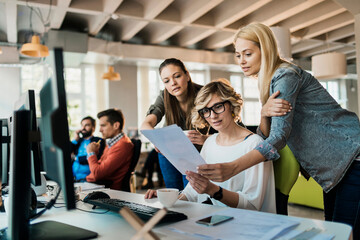 Young women working on a project together in a startup company office