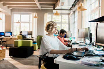 Young woman working in a startup company office