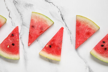 Composition with pieces of fresh ripe watermelon on light background