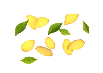 Flying slices of fresh ginger root and leaves on white background