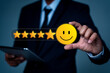 © Kampan - Hand of a businessman show happy smile face with 5 star. customer services best excellent business rating experience, Positive Review and Feedback, Satisfaction survey concept