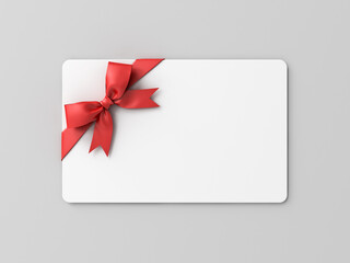 Blank white gift card with red ribbon bow isolated on grey background with shadow minimal conceptual 3D rendering