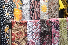 Banyuwangi, Indonesia - July 19, 2023 : Colorful Variety Of Printed Textiles And Fabrics On Display Shelves And Racks In A Textiles Store. Batik Banyuwangi Is One Of Traditional Textiles