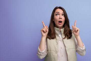 Wall Mural - emotional young brunette woman shows surprise with facial expressions and hands