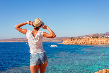 Wall Mural - Tourist woman on the Red Sea beach in Sharm el Sheikh, Sinai, Egypt